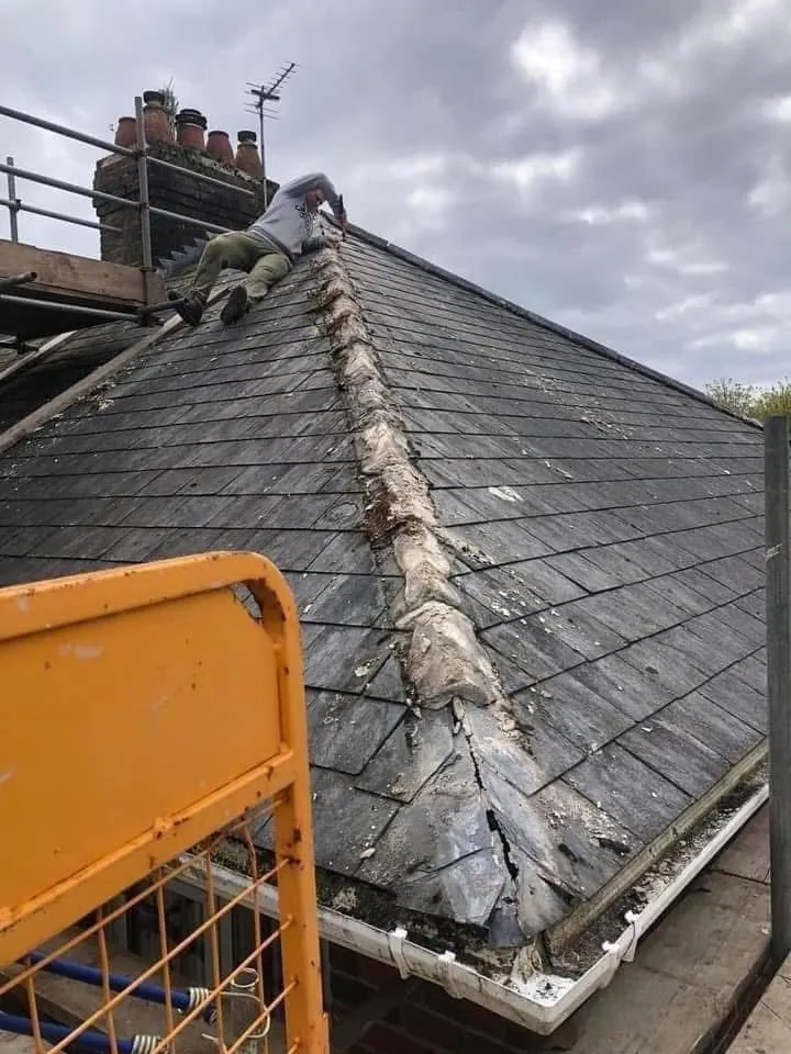 Slate roof ridge and chimney repair in Axminster
